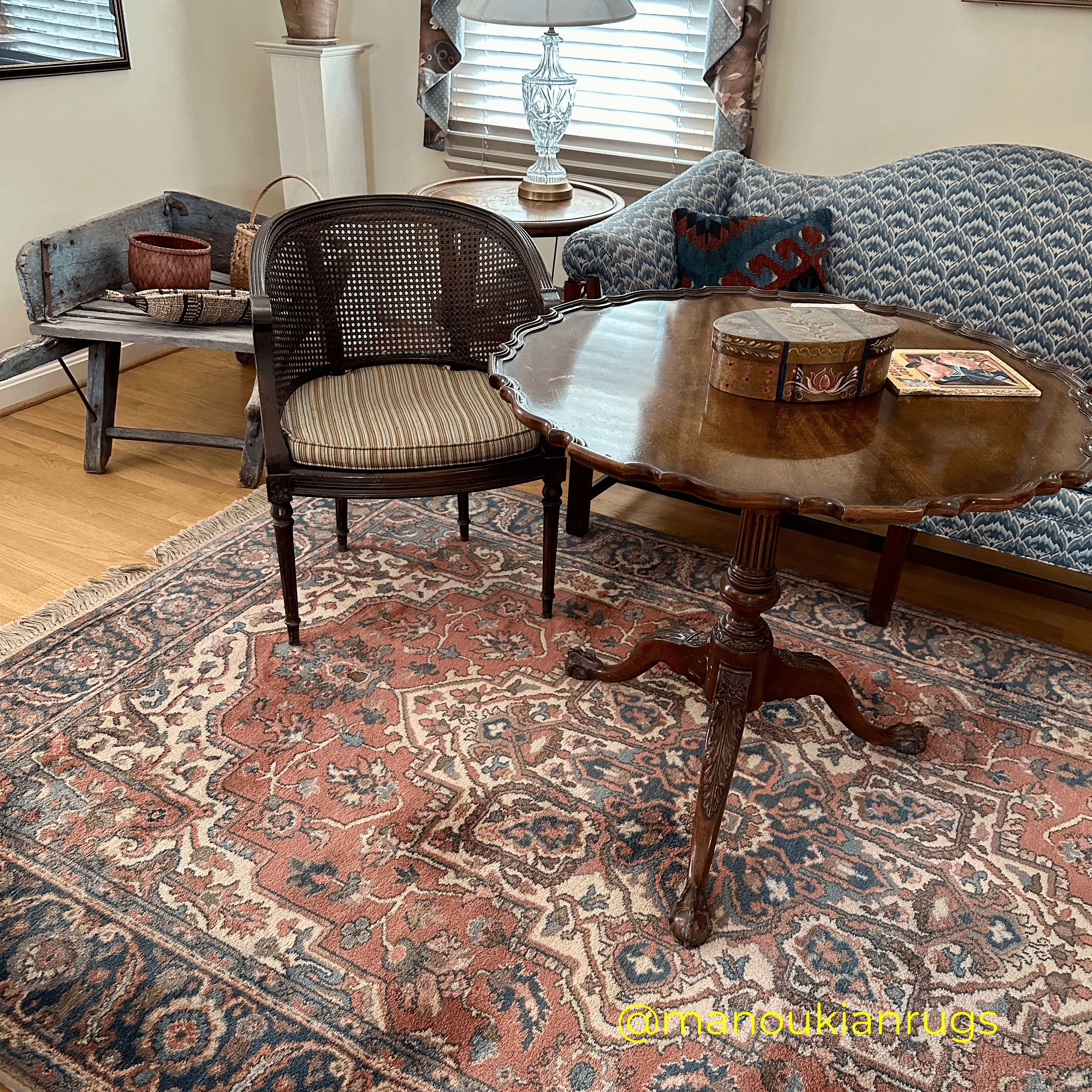 A vintage Serapi-style wool rug pulls together JD’s living room