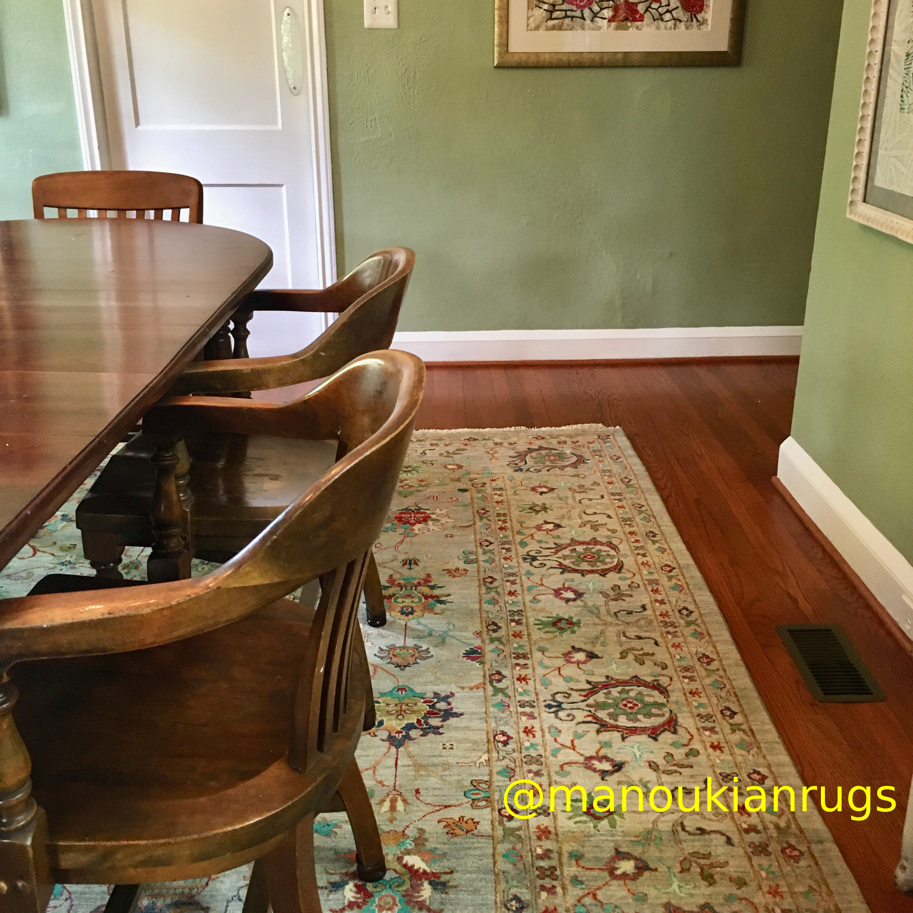 This Afghan floral rug adds a bucolic vibe to the feel of JJ’s dining room