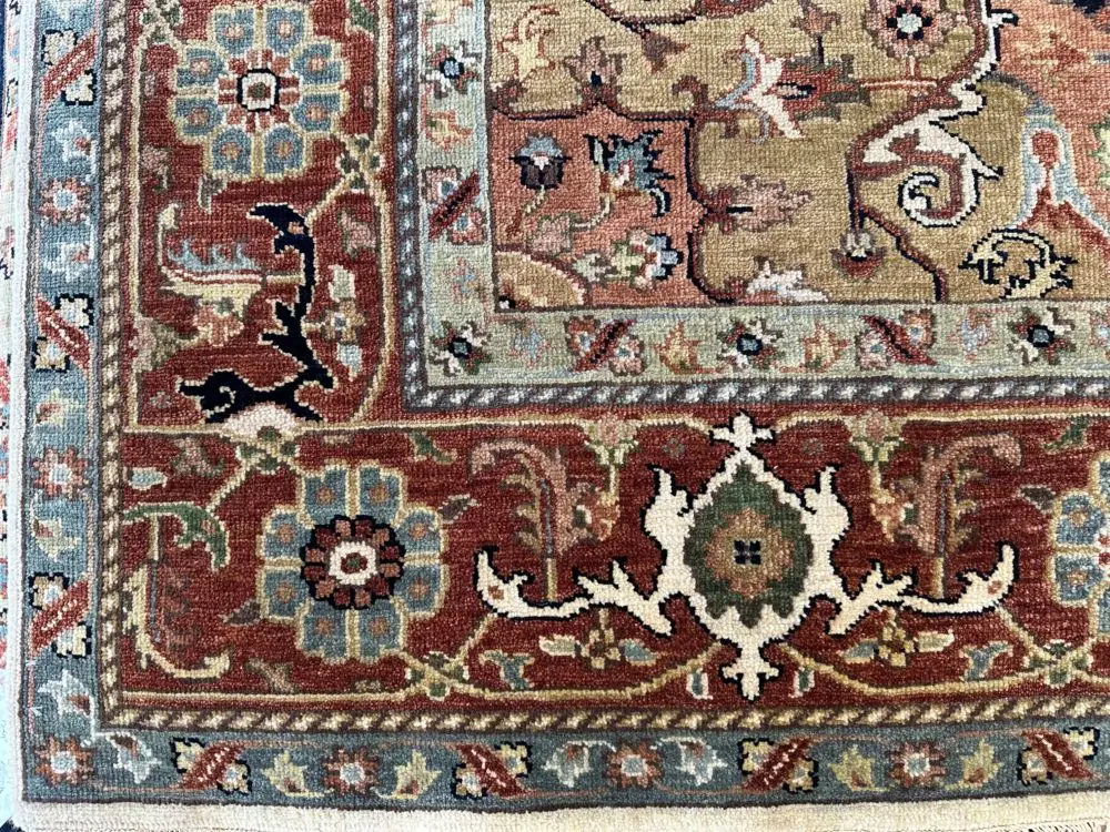 This hand knotted Indo Serapi rug lends a traditional feel to your favorite room. It carries bold geo-floral design elements along with a pleasing balance of soft colors.