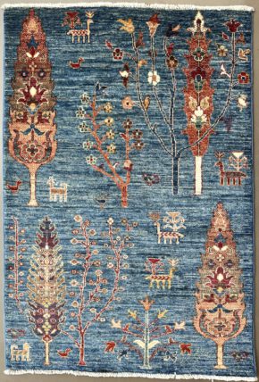 This hand knotted Afghan Khorjeen rug lends a traditional feel to your favorite room. It carries floral design elements along with a pleasing balance of blue, orange and red colors.